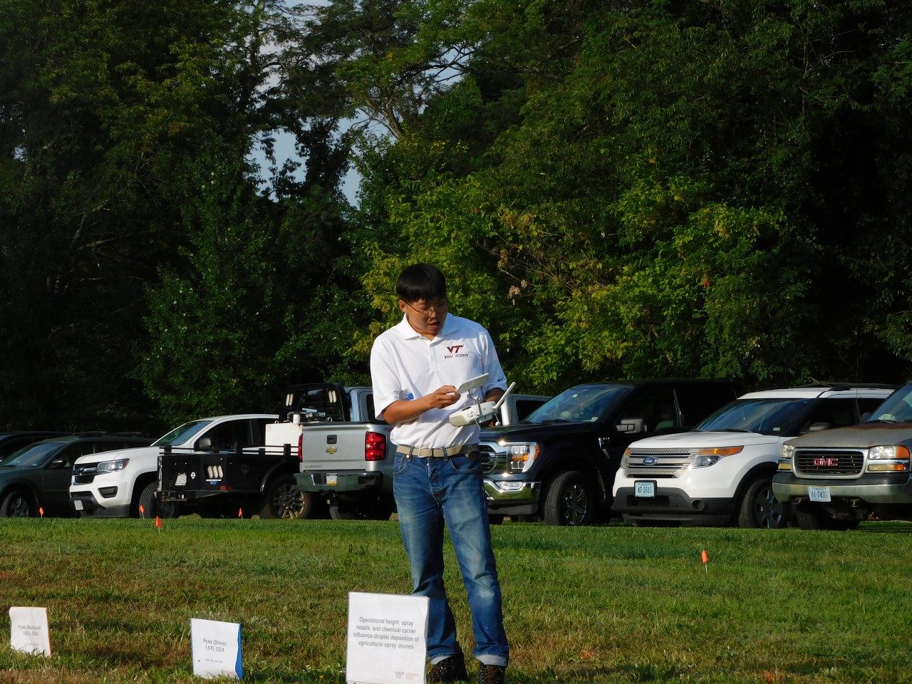 Graduate student Daewon Koo flies a drone over the field, demonstrating best practices in herbicide applications in turf systems.