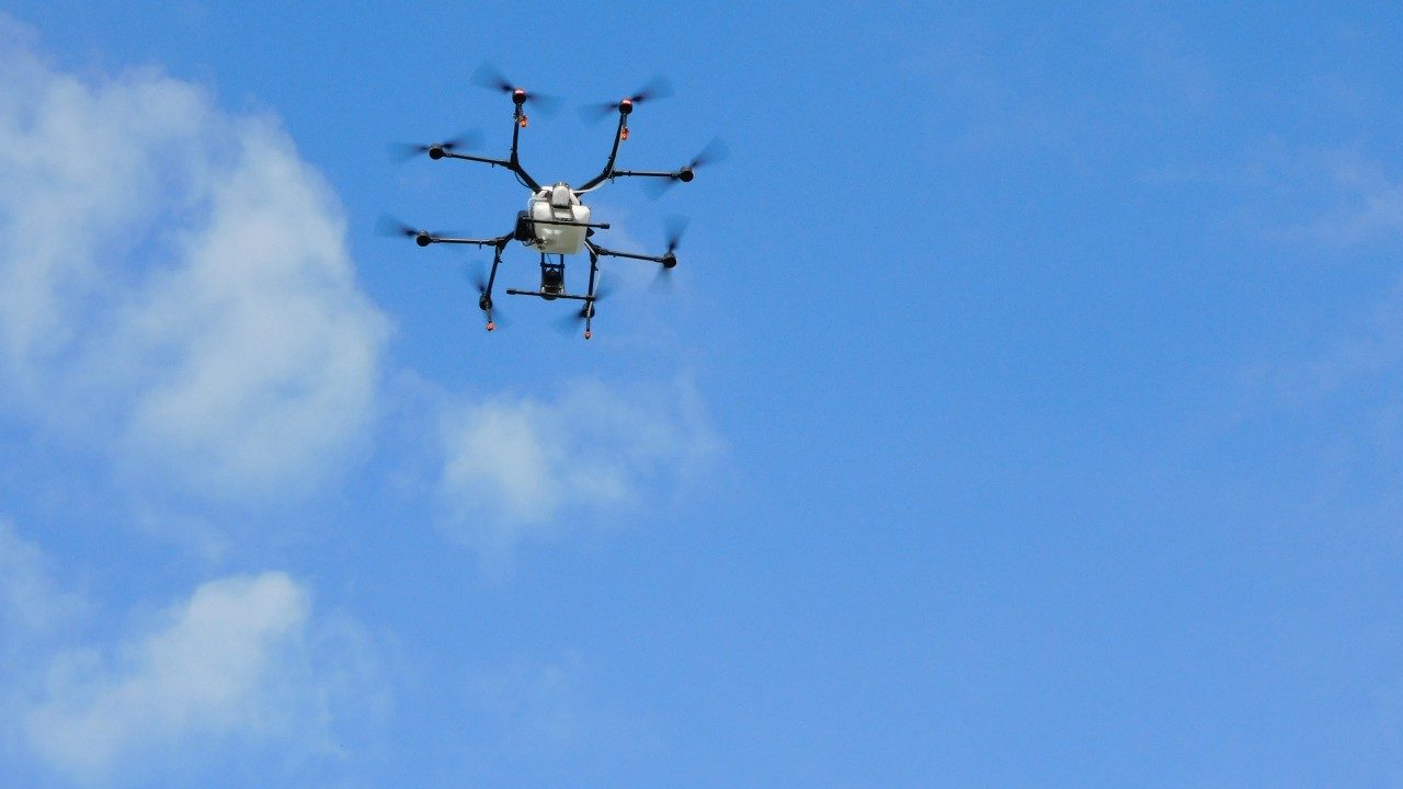 A drone flies over the Turfgrass Research Center.