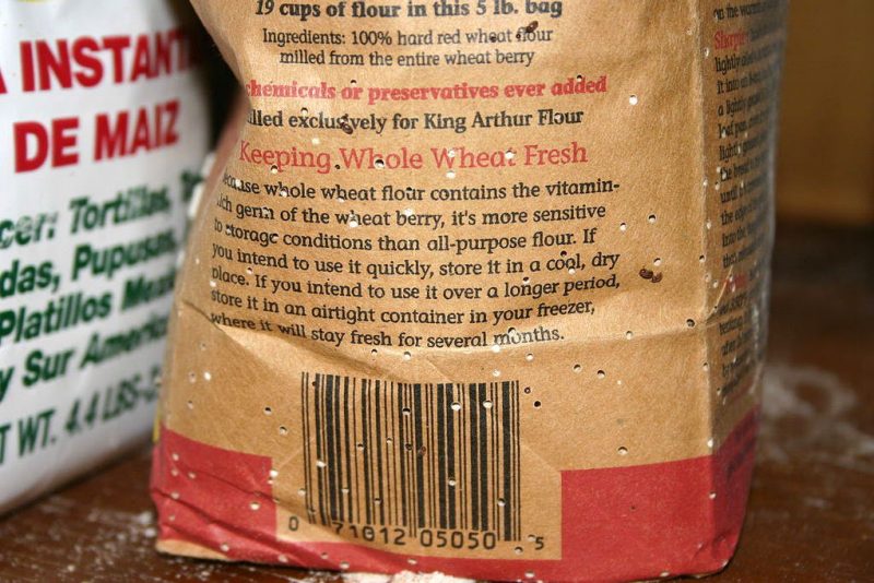 Figure 3, The paper wrapper of a bag of four shows numerous holes where stored product pests have penetrated the packaging. 