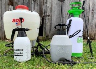 four hand-held sprayers