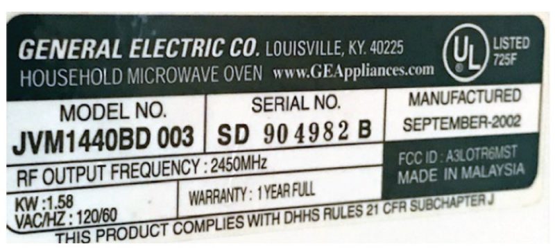 A label on a home microwave oven shows that the oven operates at 2,450 megahertz and generates and output of 1.58 kilowatts, or 1,580 watts.