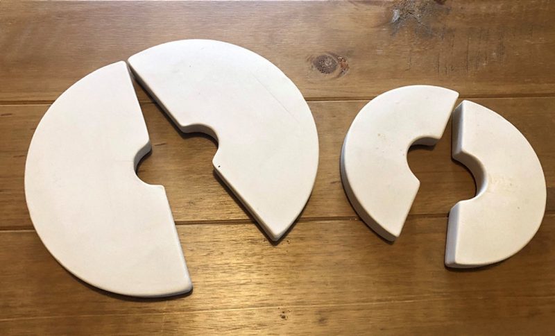 One large and one small ceramic weight.